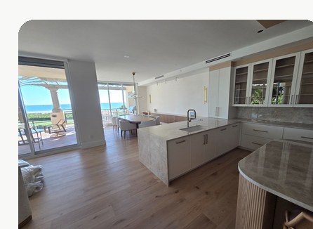 White glove delivery inside a luxury oceanfront condo with finished hardwood floors