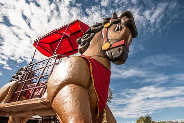 Giant Trojan-horse festival prop set in place at an outdoor event