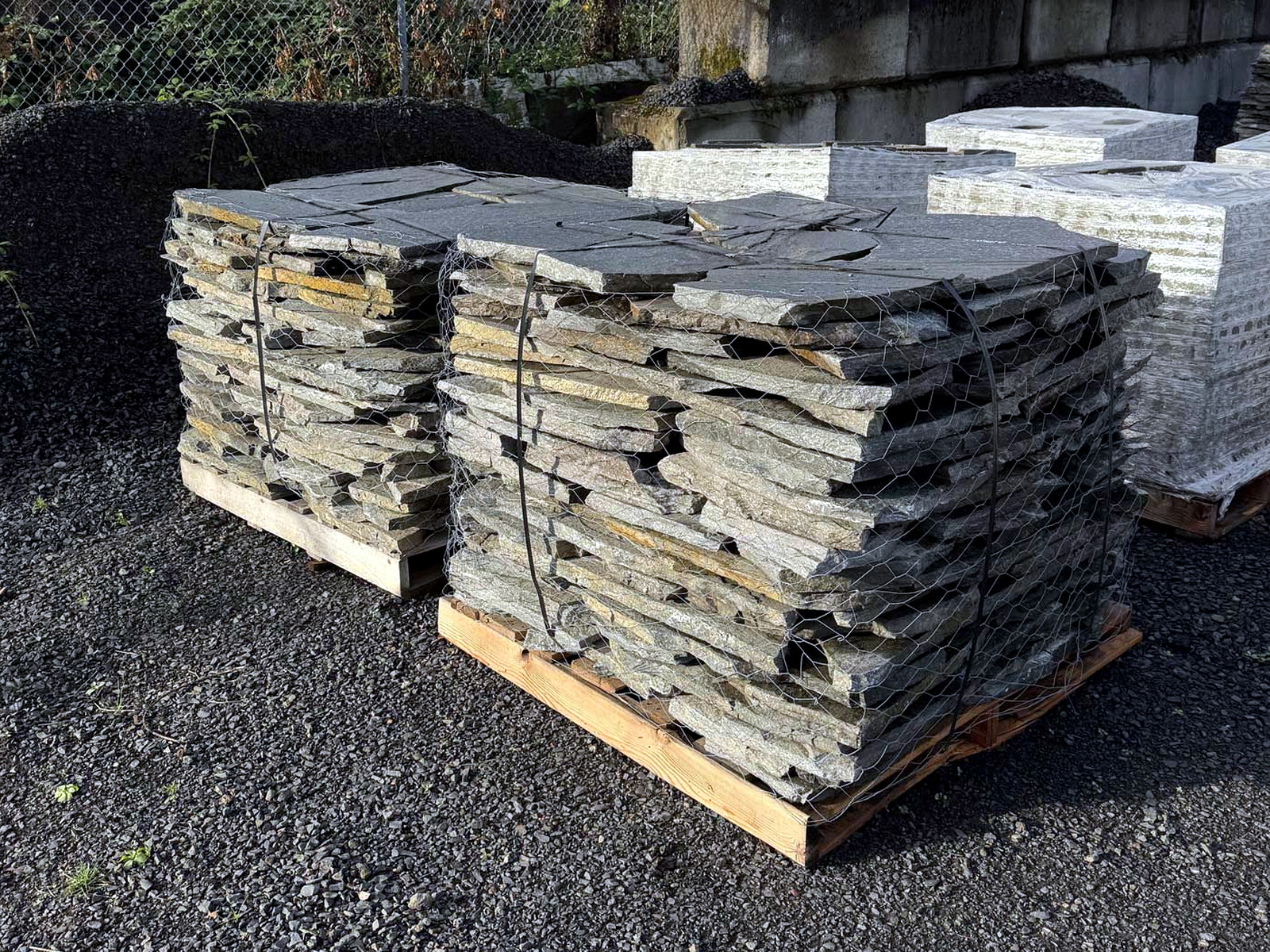 Hardscape pavers and stone placed on-site by a final-mile delivery crew